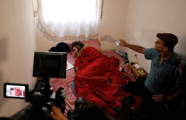 Former Guantanamo detainee Jihad Diyab from Syria lies in a bed while on a hunger strike.