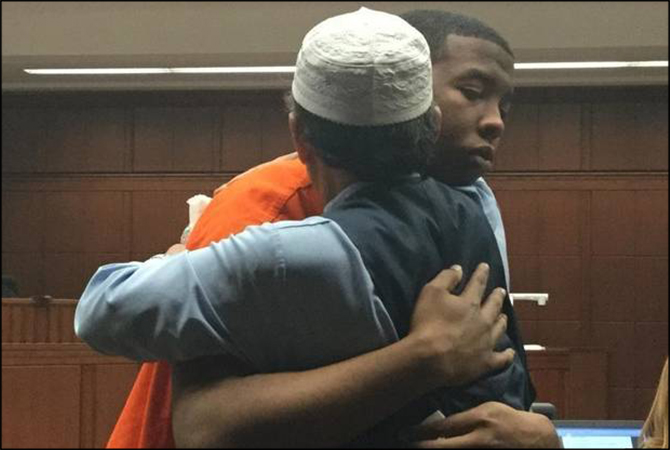 man hugs son's murderer Trey Relford 